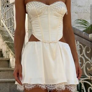 Brand new Cathie mini dress in ivory from Outcast. Not a two piece.